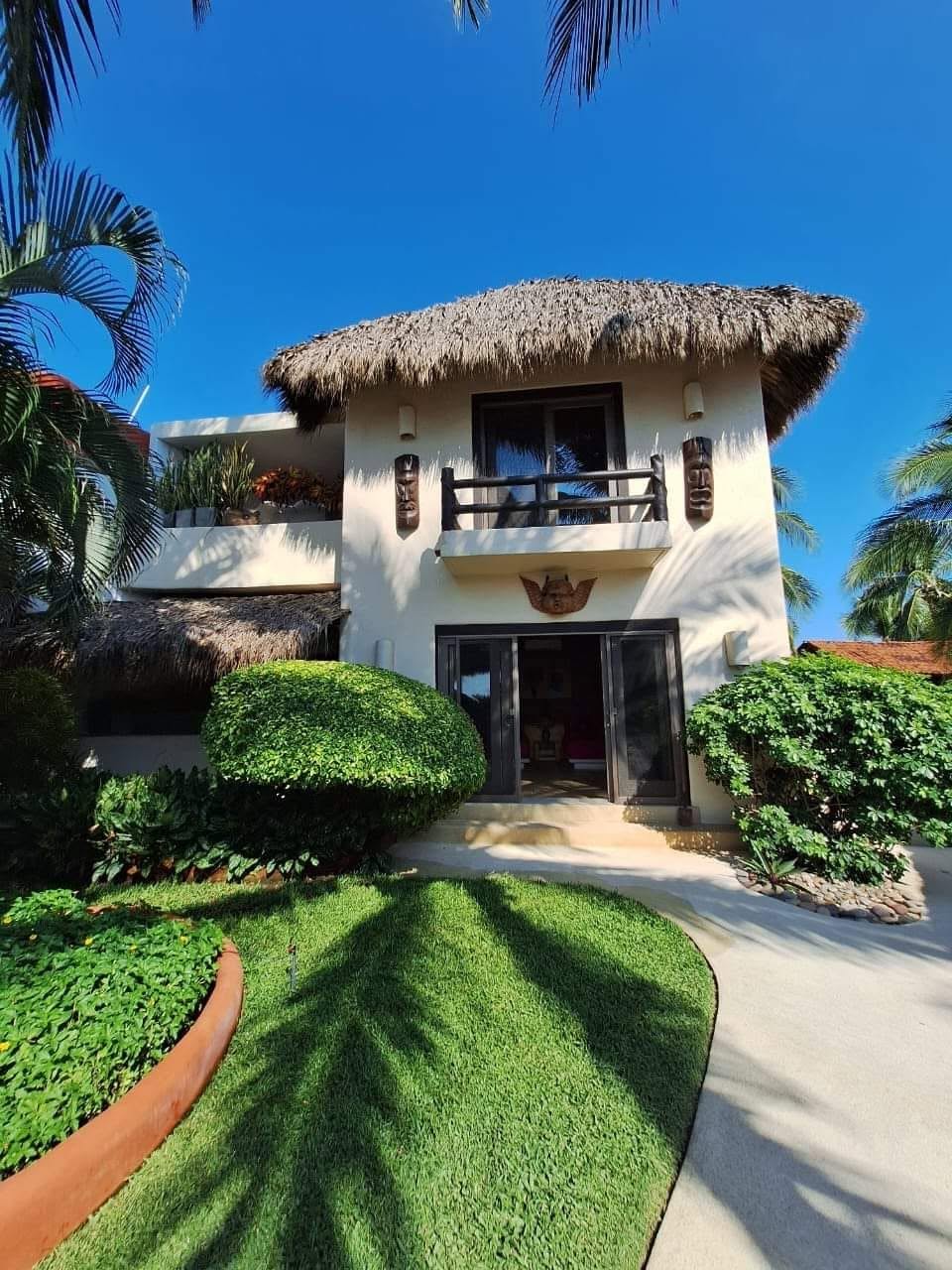 Main beachfront house and tropical garden