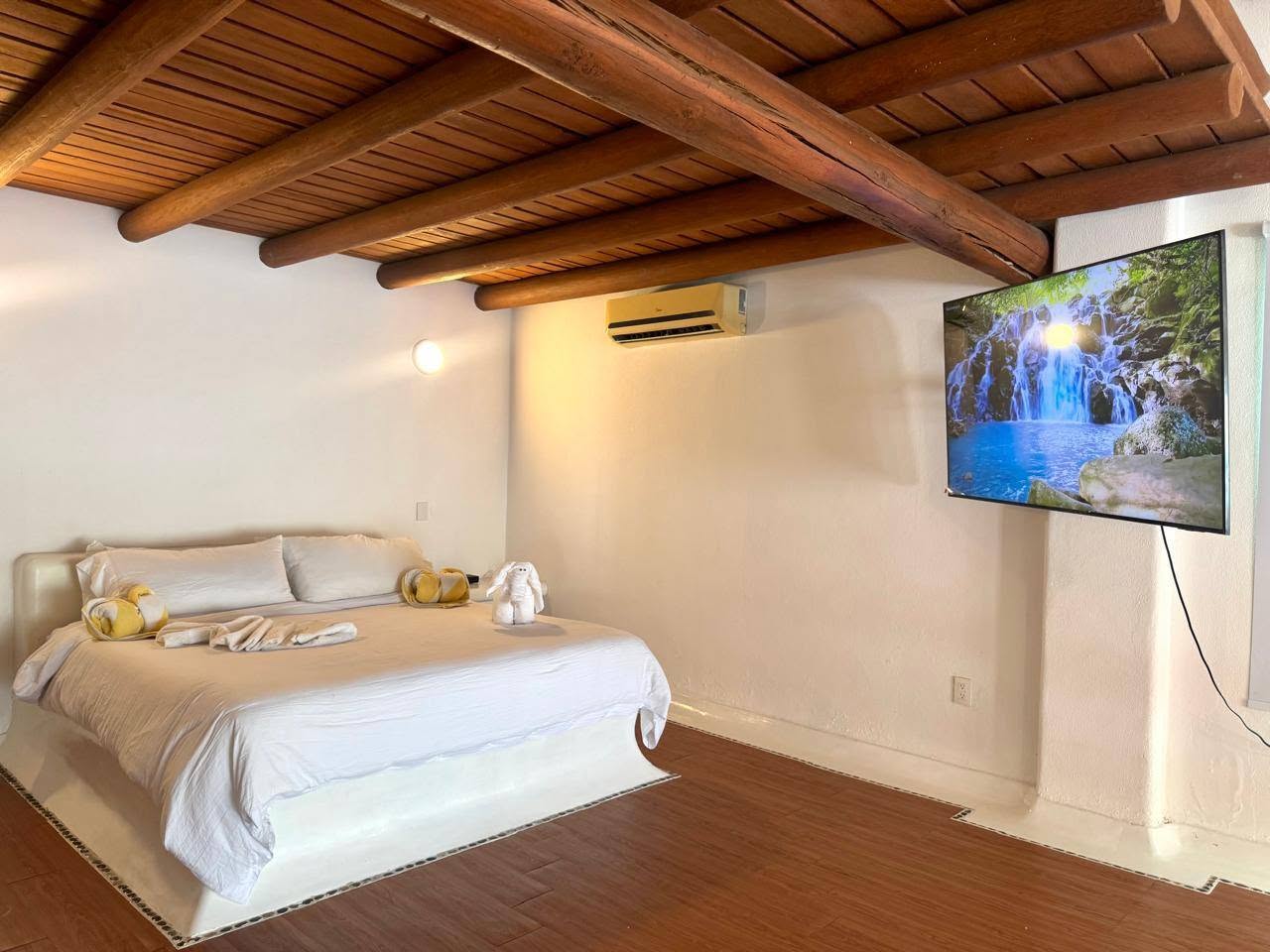 Primary bedroom with wood ceiling