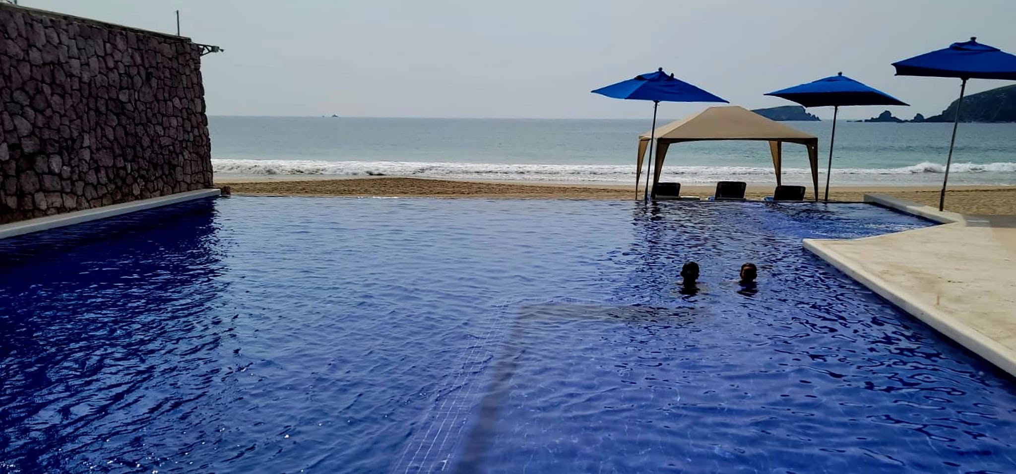 Beach club pool overlooking the ocean