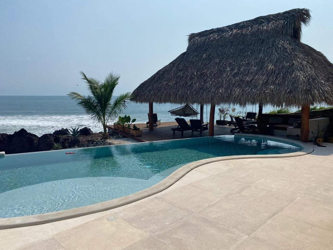 Infinity pool and oceanfront palapa at the Troncones residence